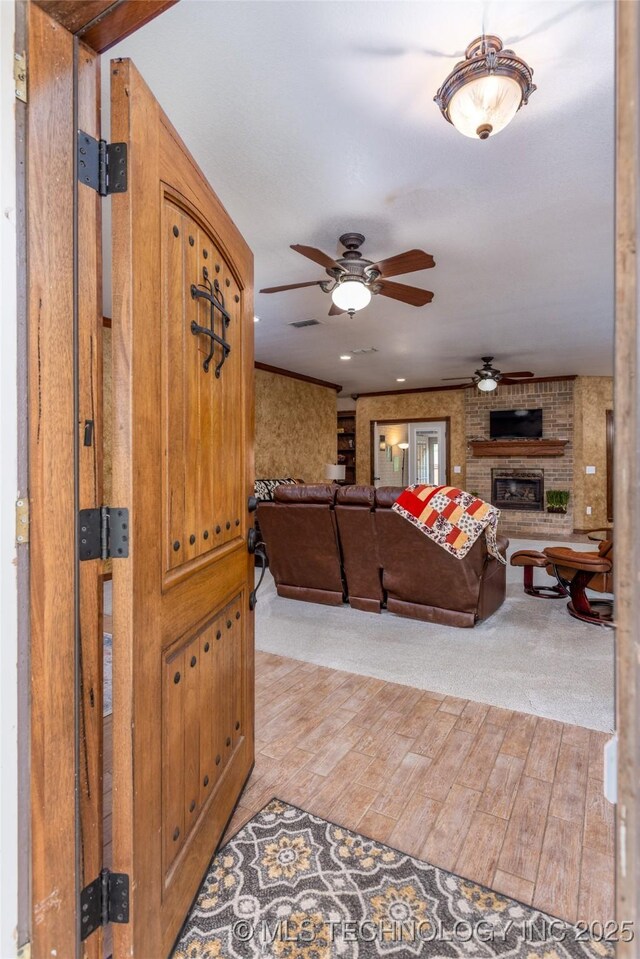 214 Kernel, Durant, OK 74701 - living area with a ceiling fan, light wood finished floors, and a brick fireplace