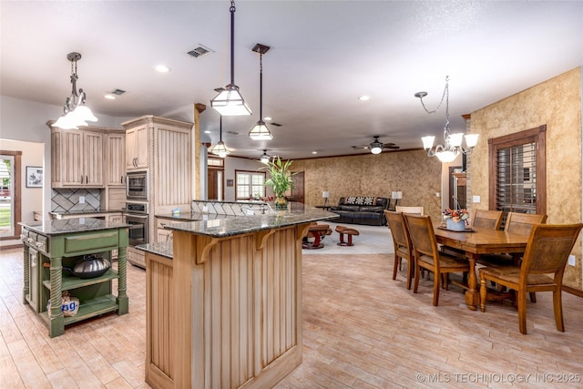 214 Kernel, Durant, OK 74701 - kitchen featuring cream cabinetry, green cabinets, light wood-style floors, healthy amount of natural light, and recessed lighting
