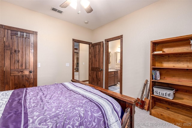 214 Kernel, Durant, OK 74701 - bedroom featuring carpet, connected bathroom, and a ceiling fan