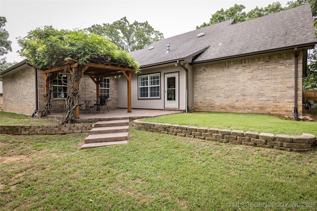 214 Kernel, Durant, OK 74701 - back of property featuring brick siding, a shingled roof, a yard, and a patio area