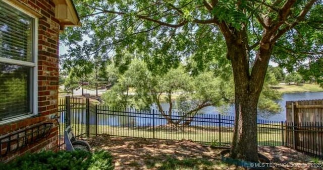 203 E 125th Pl S, Jenks, OK 74037 - water view with a fenced backyard