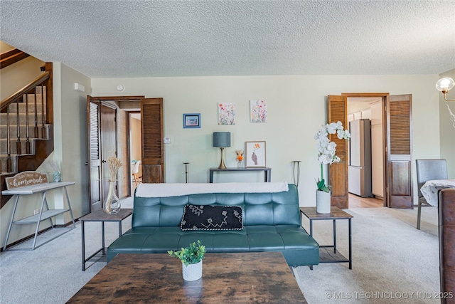 32 SE Shadowlake Dr Unit 32, Bartlesville, OK 74006 - carpeted living room with stairway and a textured ceiling
