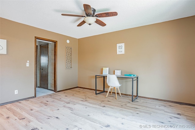 32 SE Shadowlake Dr Unit 32, Bartlesville, OK 74006 - office area featuring a ceiling fan and wood finished floors