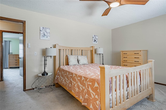 32 SE Shadowlake Dr Unit 32, Bartlesville, OK 74006 - carpeted bedroom with a textured ceiling and ceiling fan