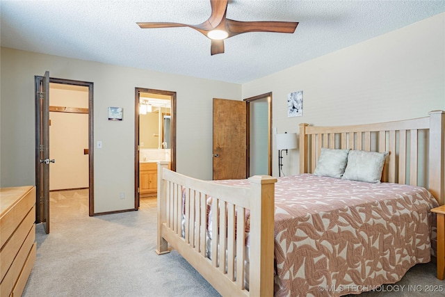 32 SE Shadowlake Dr Unit 32, Bartlesville, OK 74006 - bedroom featuring light colored carpet, a textured ceiling, connected bathroom, and a ceiling fan
