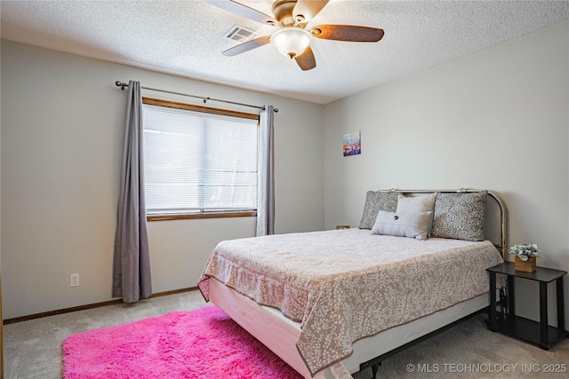 32 SE Shadowlake Dr Unit 32, Bartlesville, OK 74006 - carpeted bedroom with a textured ceiling and a ceiling fan