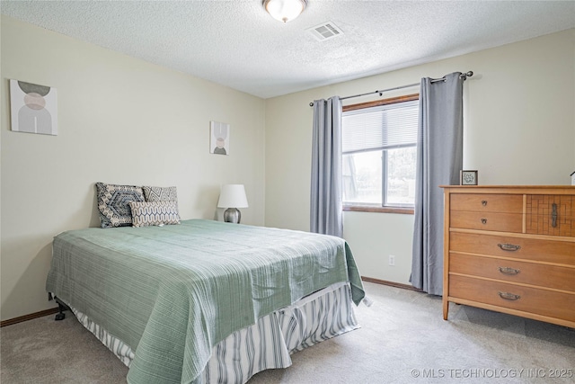32 SE Shadowlake Dr Unit 32, Bartlesville, OK 74006 - bedroom featuring light colored carpet and a textured ceiling
