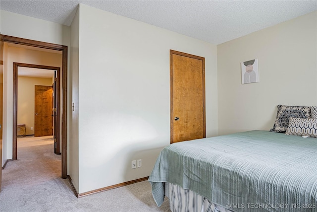 32 SE Shadowlake Dr Unit 32, Bartlesville, OK 74006 - bedroom featuring light colored carpet and a textured ceiling