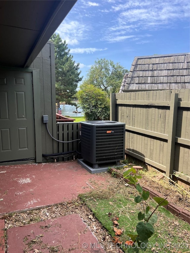 32 SE Shadowlake Dr Unit 32, Bartlesville, OK 74006 - view of patio with a water view