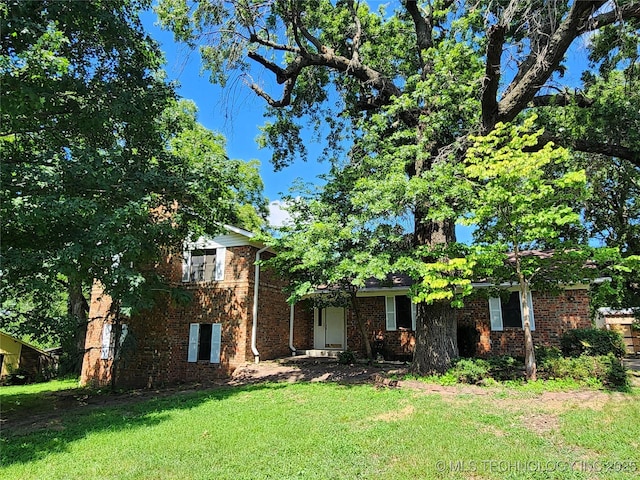 1181 Deer Crk, Pryor, OK 74361 - view of front of house with a front lawn and brick siding
