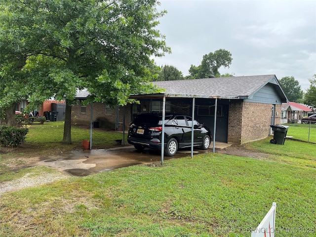 201 NE 18th Ave, Durant, OK 74701 - view of vehicle parking with driveway and a carport