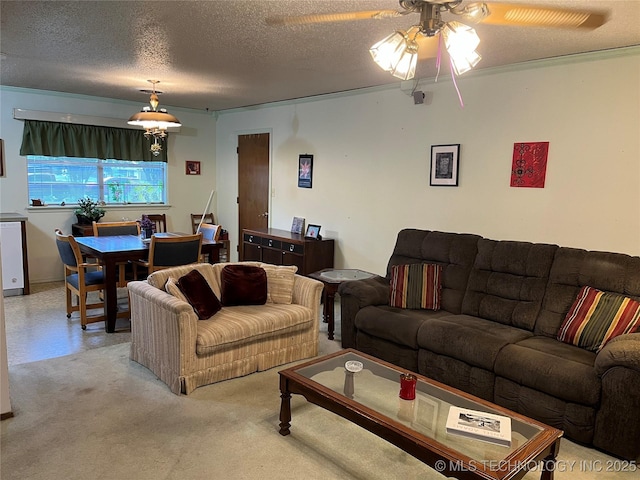 201 NE 18th Ave, Durant, OK 74701 - carpeted living room with a ceiling fan and a textured ceiling