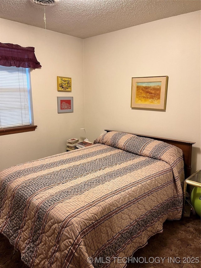 201 NE 18th Ave, Durant, OK 74701 - view of carpeted bedroom