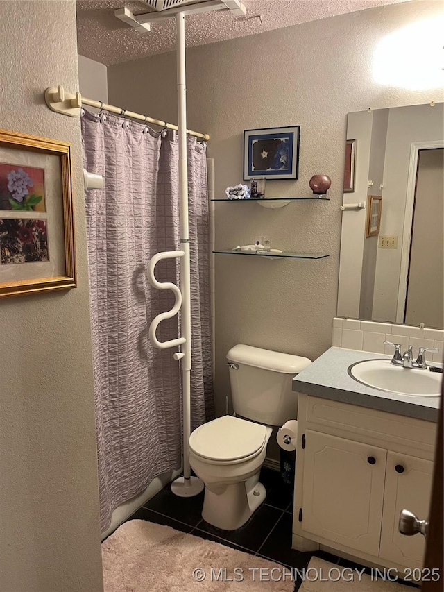 201 NE 18th Ave, Durant, OK 74701 - bathroom featuring a textured wall, tile patterned floors, vanity, and curtained shower