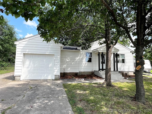 1424 S Penn Ave, Bartlesville, OK 74003 - view of front of property with an attached garage and driveway