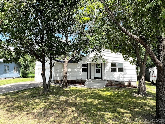 1424 S Penn Ave, Bartlesville, OK 74003 - view of front of property featuring concrete driveway, a front lawn, crawl space, and an attached garage