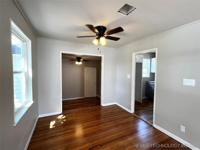1424 S Penn Ave, Bartlesville, OK 74003 - spare room with dark wood-type flooring, ceiling fan, and crown molding