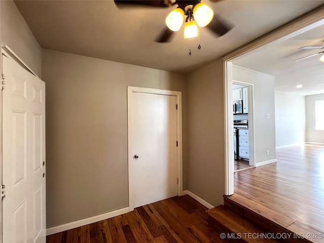 1424 S Penn Ave, Bartlesville, OK 74003 - unfurnished bedroom with wood finished floors and ceiling fan