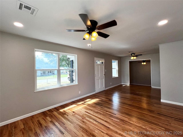 1424 S Penn Ave, Bartlesville, OK 74003 - unfurnished living room featuring a ceiling fan, wood finished floors, and recessed lighting
