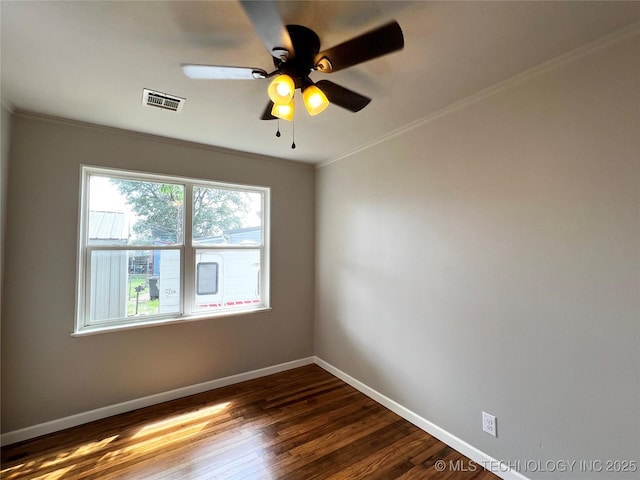 1424 S Penn Ave, Bartlesville, OK 74003 - unfurnished room with ornamental molding, dark wood-style floors, and ceiling fan