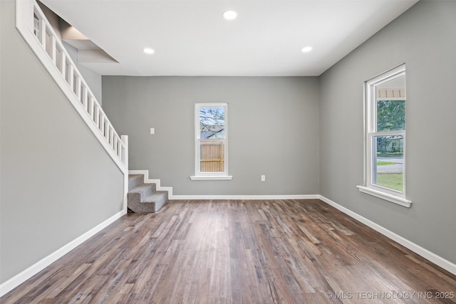 202 N Creek, Dewey, OK 74029 - unfurnished living room with stairway, wood finished floors, and recessed lighting