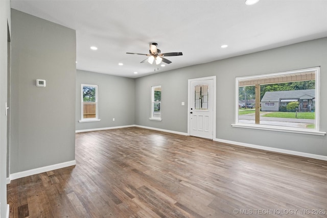 202 N Creek, Dewey, OK 74029 - unfurnished living room featuring ceiling fan, recessed lighting, and wood finished floors