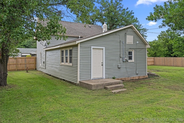 202 N Creek, Dewey, OK 74029 - rear view of house featuring a fenced backyard and a shingled roof