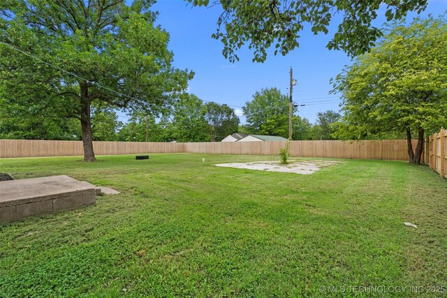 202 N Creek, Dewey, OK 74029 - fenced backyard with a patio