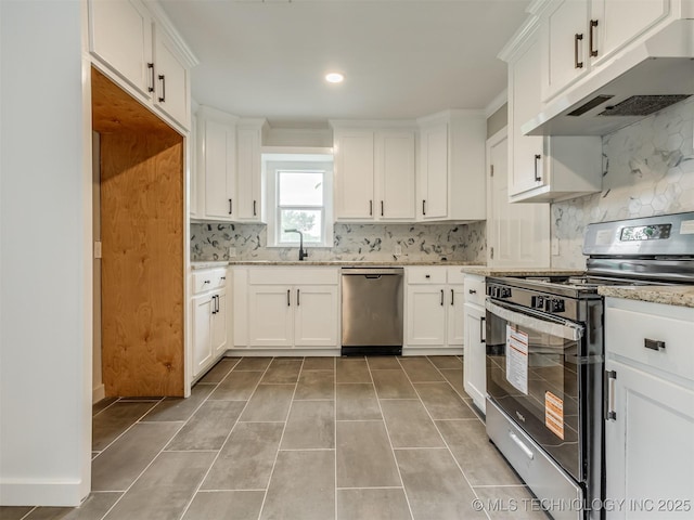 3226 N Garrison Ave, Tulsa, OK 74106 - kitchen with stainless steel appliances, under cabinet range hood, white cabinetry, tasteful backsplash, and light stone countertops