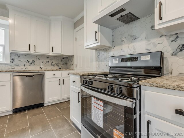 3226 N Garrison Ave, Tulsa, OK 74106 - kitchen with stainless steel appliances, premium range hood, backsplash, white cabinets, and tile patterned floors