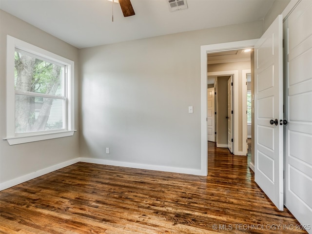 3226 N Garrison Ave, Tulsa, OK 74106 - unfurnished room featuring dark wood-style flooring and a ceiling fan