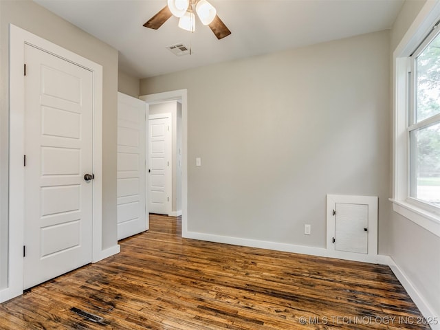 3226 N Garrison Ave, Tulsa, OK 74106 - unfurnished bedroom featuring dark wood-style flooring and a ceiling fan