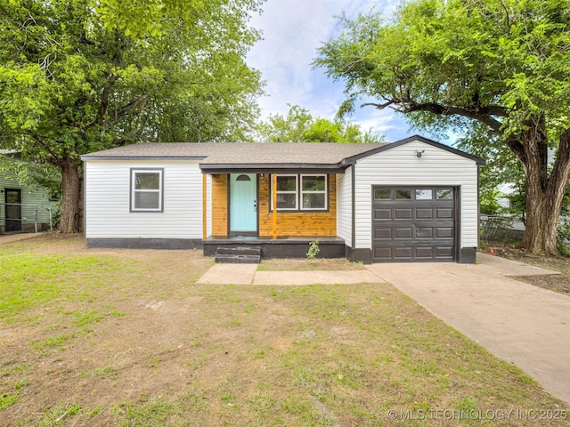 3226 N Garrison Ave, Tulsa, OK 74106 - view of front of house featuring a garage and concrete driveway