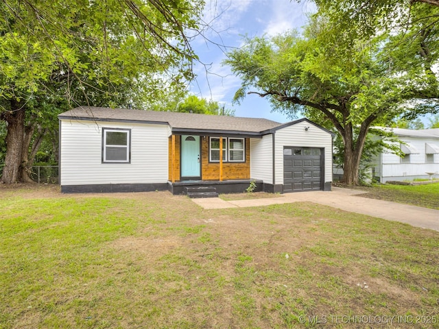3226 N Garrison Ave, Tulsa, OK 74106 - view of front facade featuring an attached garage and concrete driveway