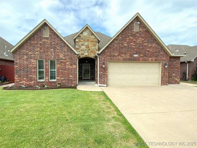 4706 S 182nd E Ave, Tulsa, OK 74134 - traditional home with concrete driveway, a front lawn, an attached garage, brick siding, and roof with shingles