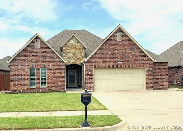 4706 S 182nd E Ave, Tulsa, OK 74134 - traditional-style house featuring driveway, a front lawn, an attached garage, and brick siding