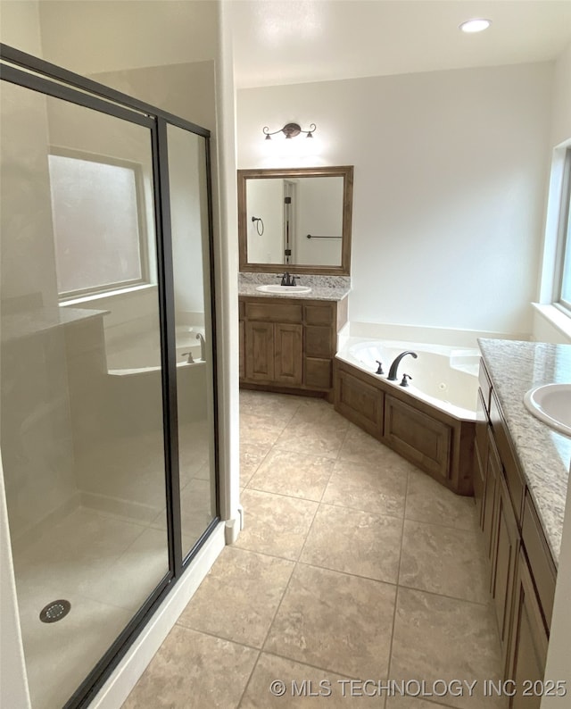 4706 S 182nd E Ave, Tulsa, OK 74134 - full bath with two vanities, a stall shower, a whirlpool tub, and tile patterned flooring