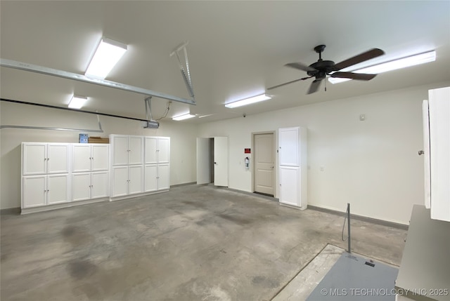 4706 S 182nd E Ave, Tulsa, OK 74134 - garage with a garage door opener and a ceiling fan