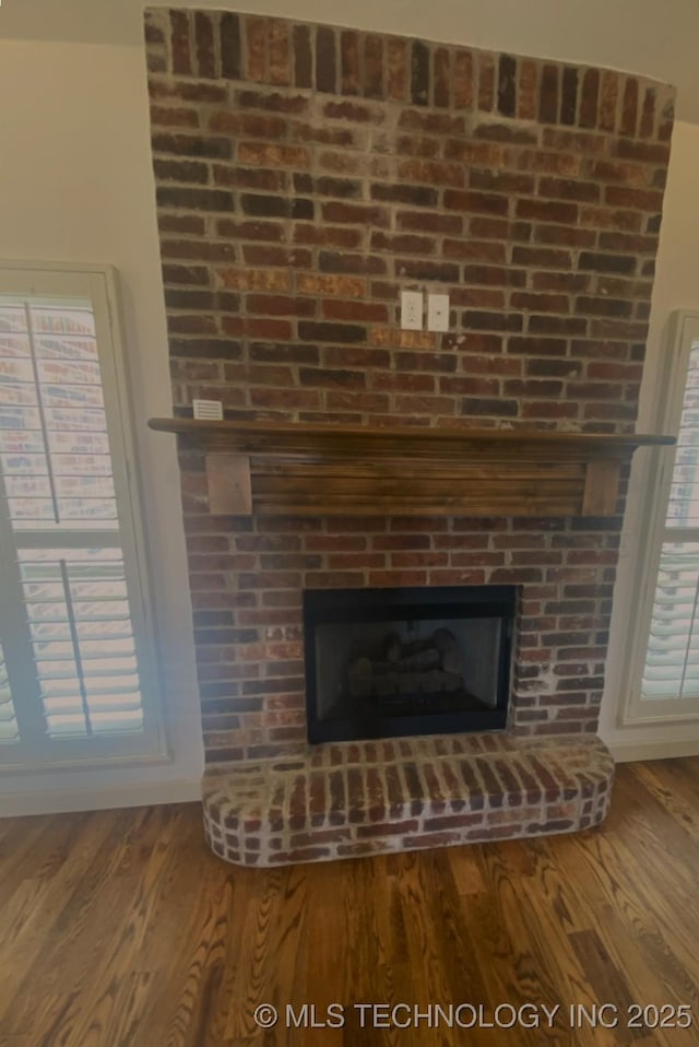 4706 S 182nd E Ave, Tulsa, OK 74134 - detailed view of a brick fireplace and wood finished floors