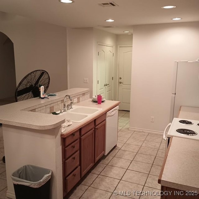 200 Ogeechee, Ramona, OK 74061 - kitchen featuring white appliances, light countertops, recessed lighting, light tile patterned floors, and arched walkways