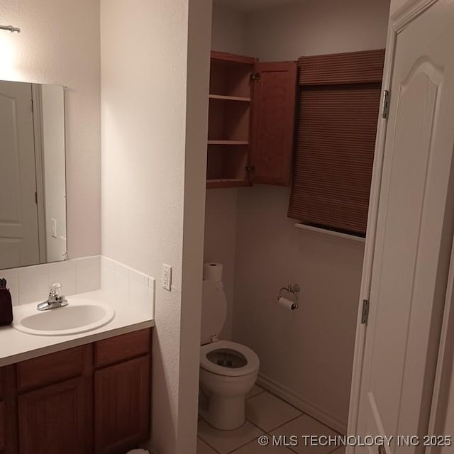 200 Ogeechee, Ramona, OK 74061 - bathroom featuring vanity, tile patterned flooring, and a textured wall