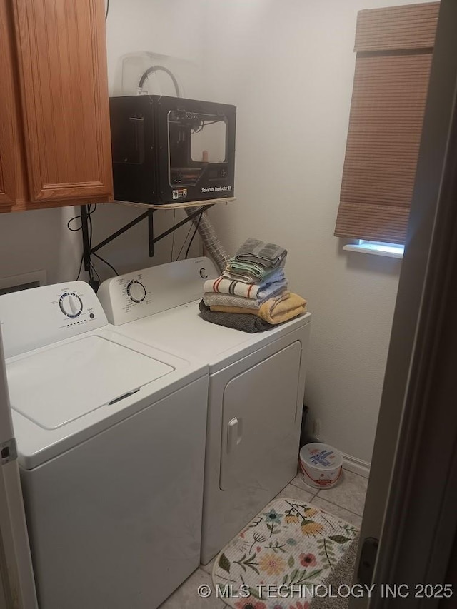 200 Ogeechee, Ramona, OK 74061 - laundry area with cabinet space, separate washer and dryer, and tile patterned floors