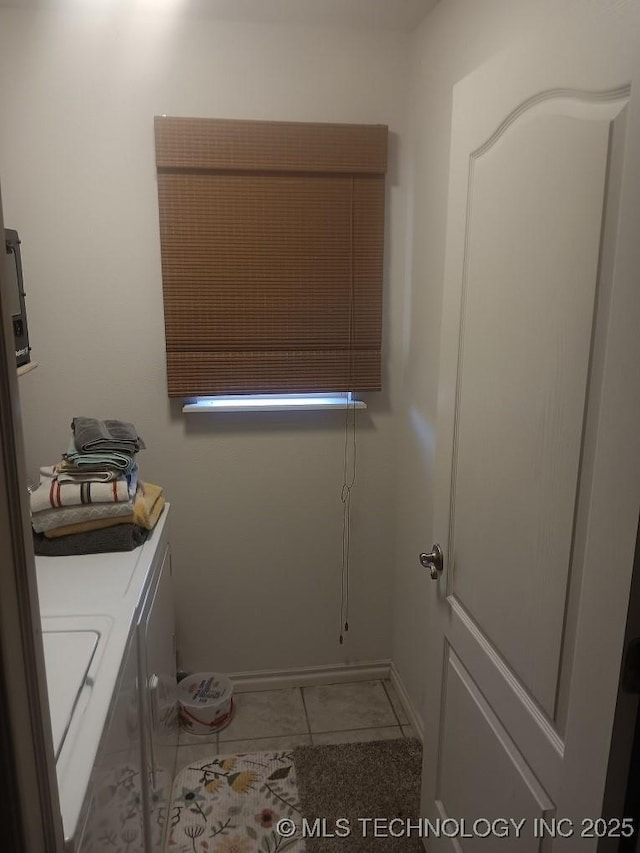 200 Ogeechee, Ramona, OK 74061 - laundry area featuring washer and dryer and baseboards