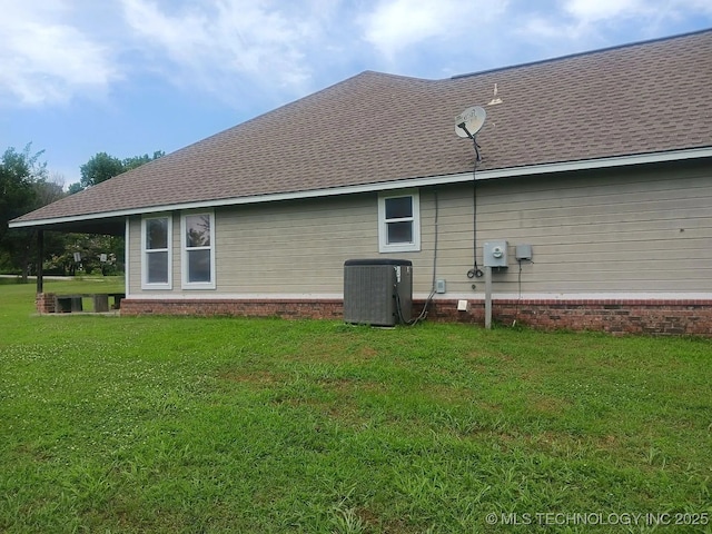 200 Ogeechee, Ramona, OK 74061 - rear view of house with a yard and roof with shingles