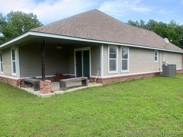 200 Ogeechee, Ramona, OK 74061 - rear view of house featuring a shingled roof, a yard, and a patio