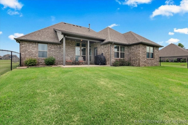 30130 S Maxine Ave, Inola, OK 74036 - back of property featuring brick siding, a fenced backyard, a shingled roof, and a patio