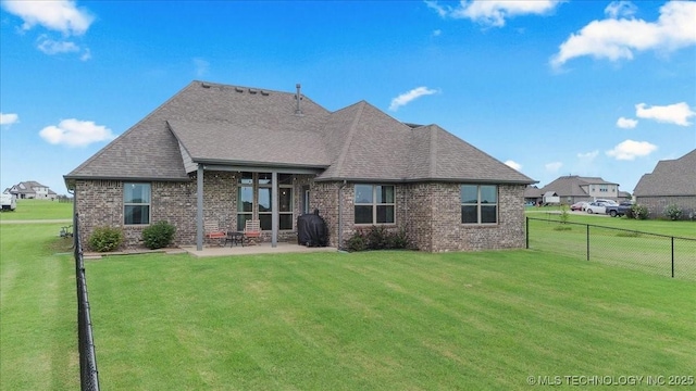 30130 S Maxine Ave, Inola, OK 74036 - back of property featuring brick siding, a patio, and roof with shingles