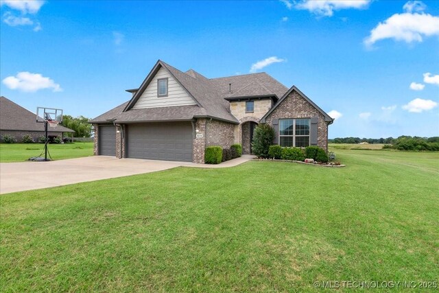 30130 S Maxine Ave, Inola, OK 74036 - traditional-style house featuring brick siding, a front lawn, concrete driveway, and a garage
