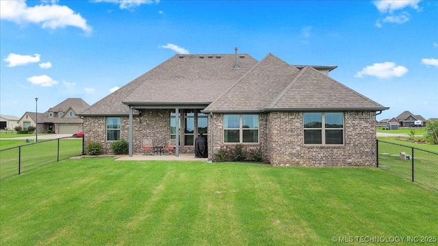 30130 S Maxine Ave, Inola, OK 74036 - back of property featuring brick siding, a patio area, a fenced backyard, and a shingled roof