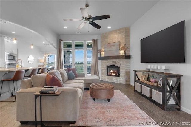 30130 S Maxine Ave, Inola, OK 74036 - living room featuring ceiling fan, wood finished floors, a fireplace, and recessed lighting